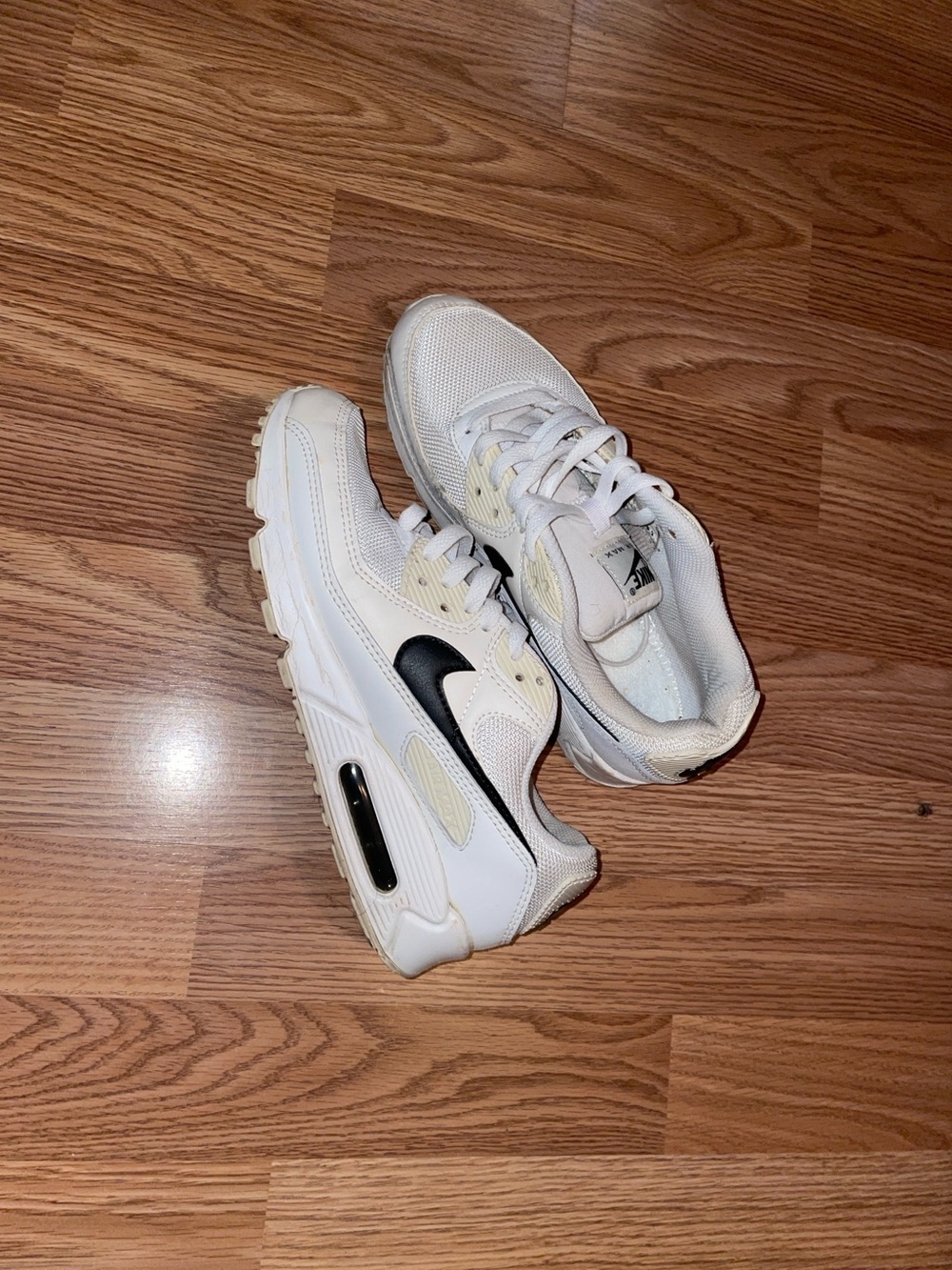 Nike White Sneakers with Black Swoosh Detail